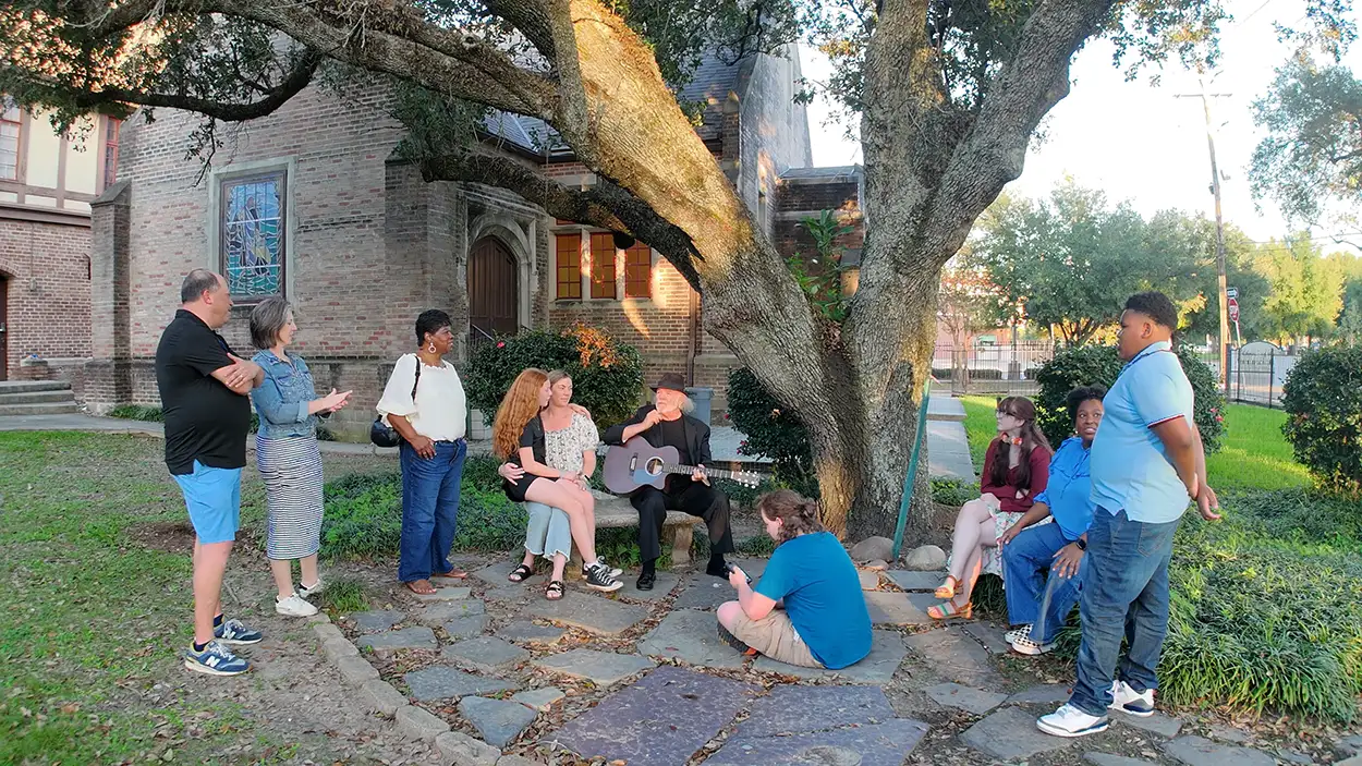 group outside singing at church